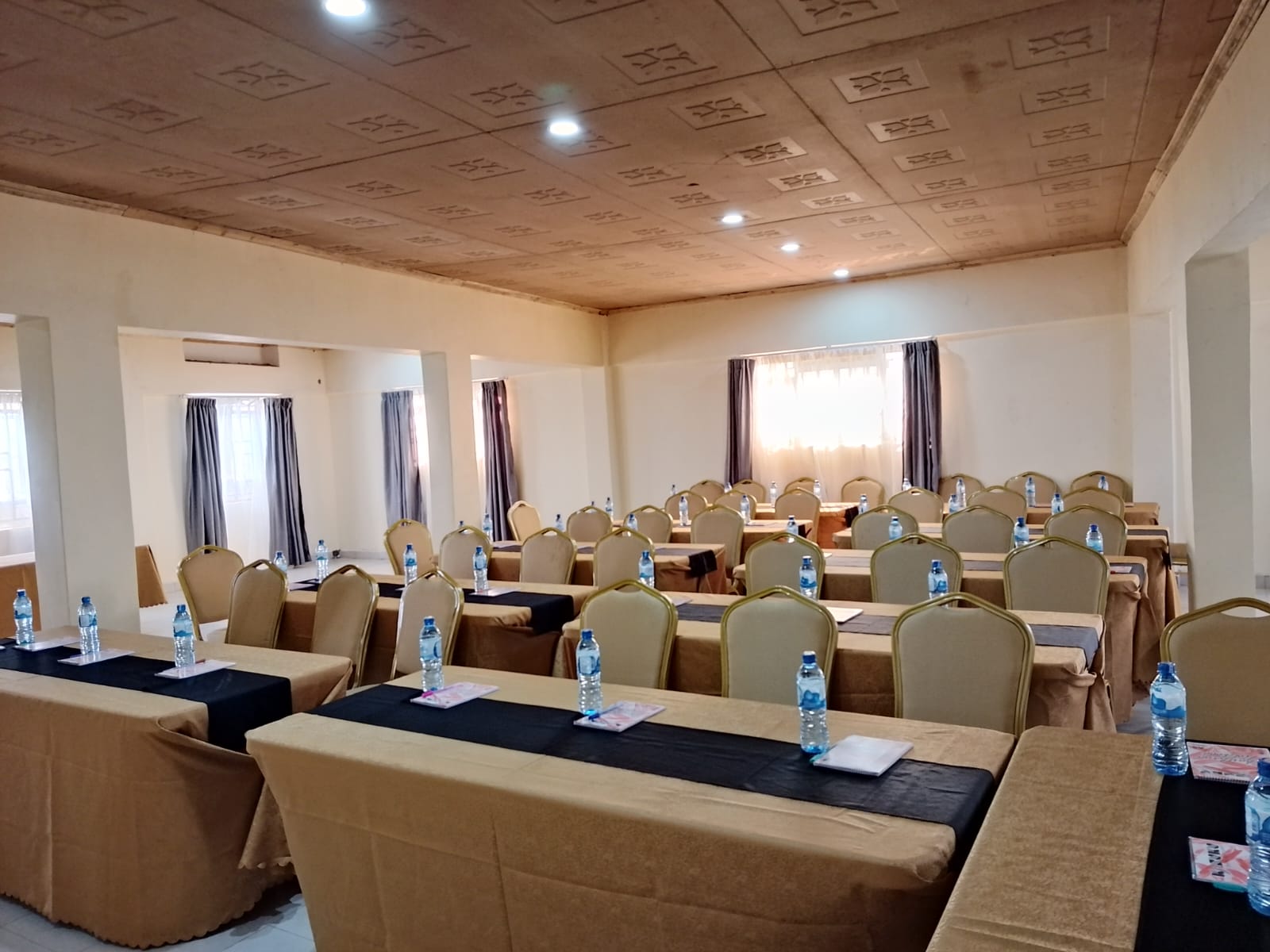 The Ellena Hotel conference hall arranged classroom-style, seats 100